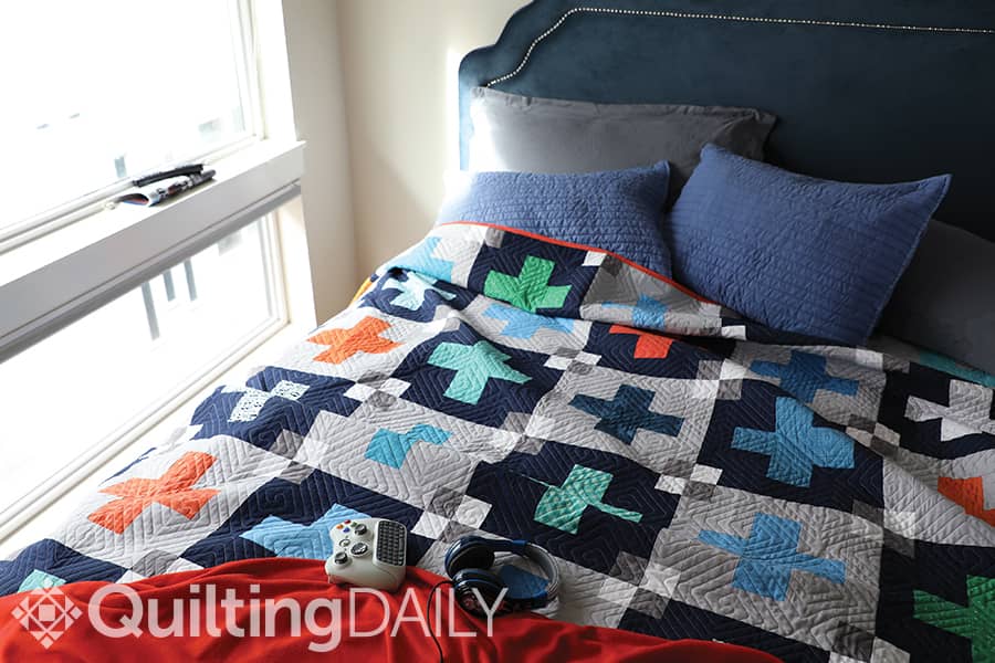 Free pattern: Tweens - Tweens quilt displayed on a bed