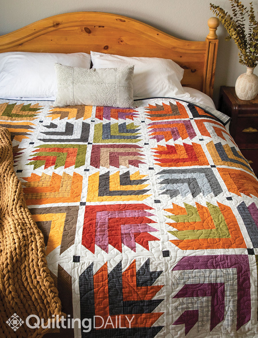 Free pattern: Leaf Stacks - Leaf Stacks pattern displayed as a comforter on a bed