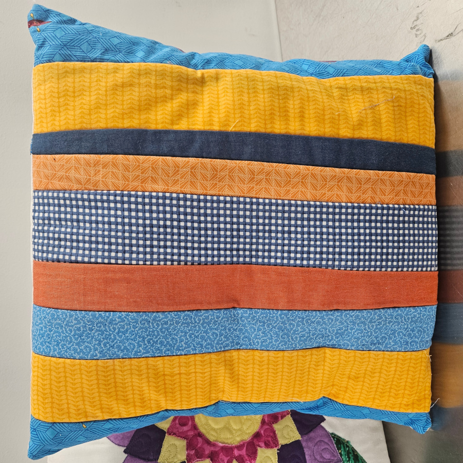 Creative longarm quilting projects to use up extra fabric - pillow made of sraps