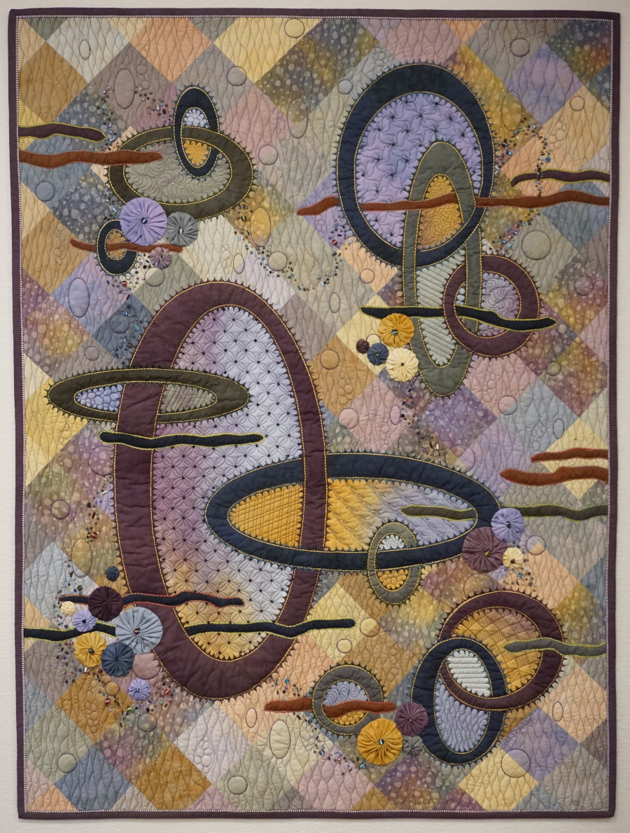 Dreamweaver art quilt with ovals and yo-yos by Beth Shilling